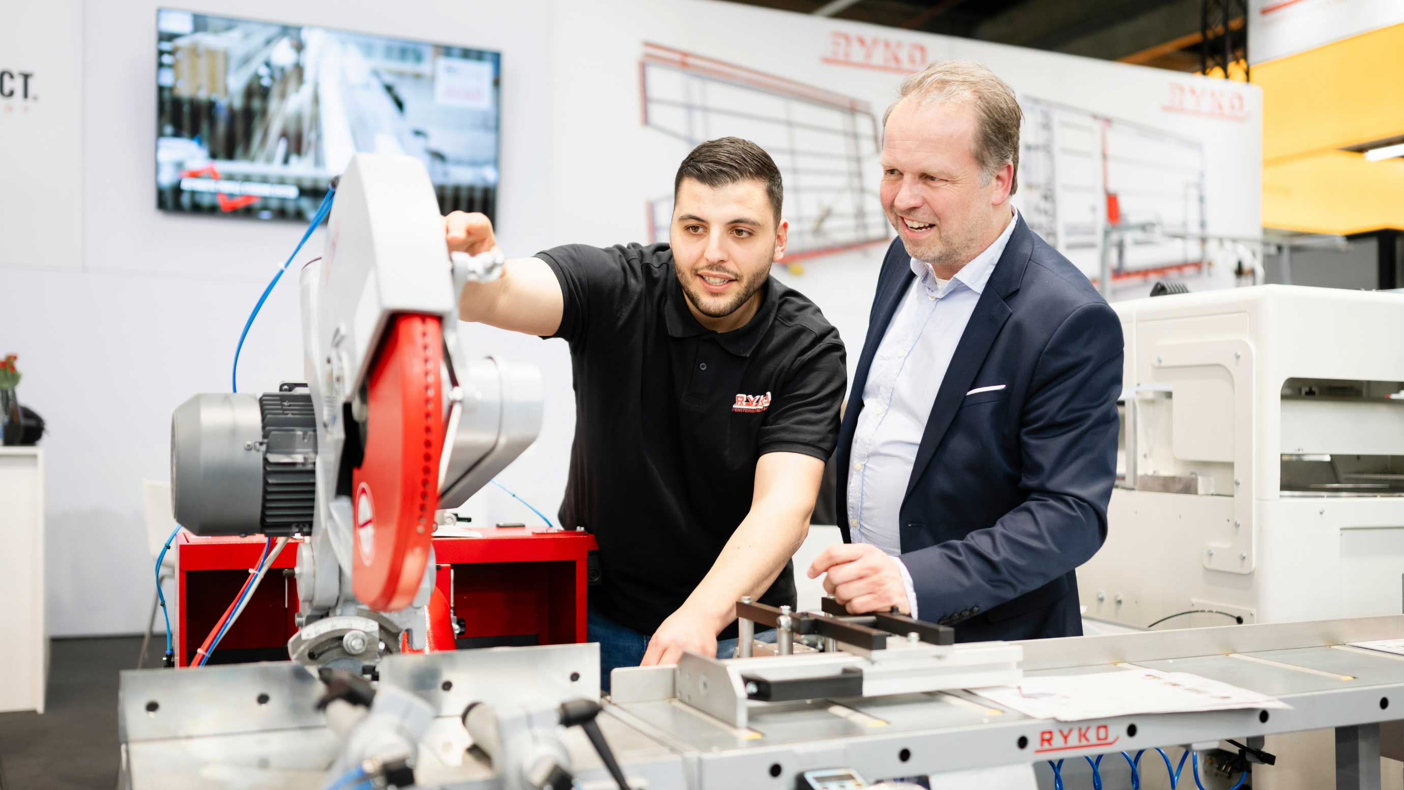 An exhibitor showcases a machine